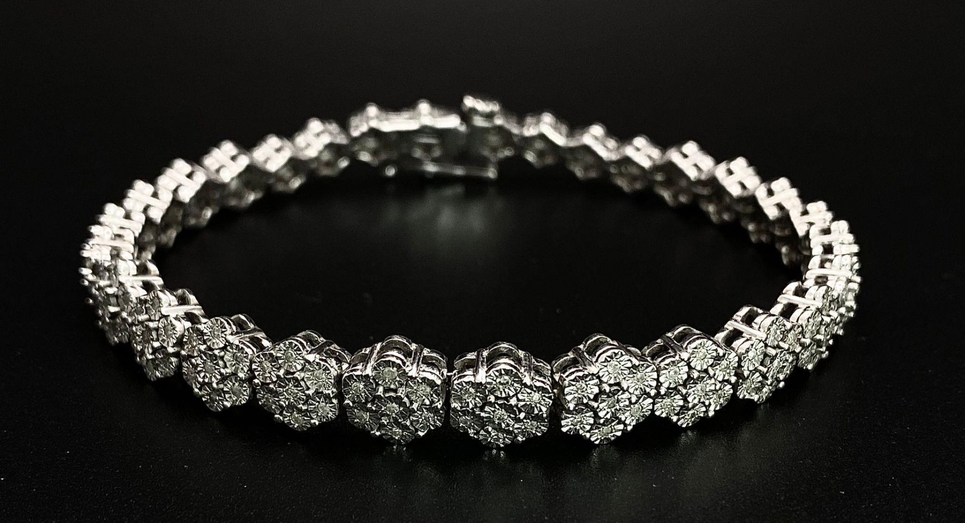 A 9K White Gold Graduated Link Diamond Tennis Bracelet. 29 links of seven small diamonds - 203 - Image 2 of 9