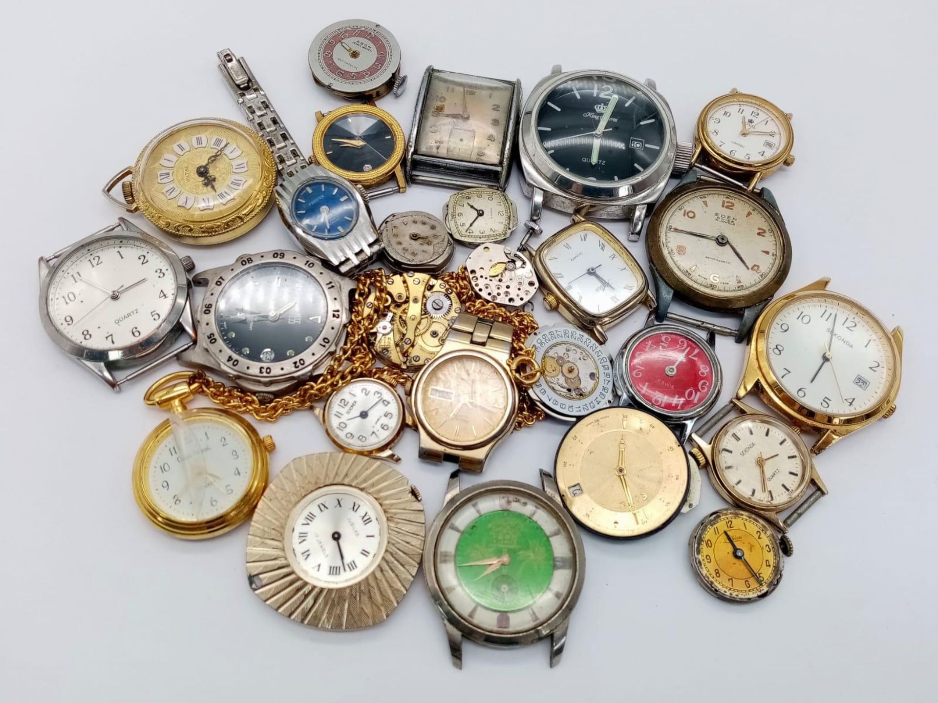 18 Watch Cases with Movements PLUS Nine Loose Watch Movements. Great for spare parts.
