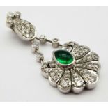 An 18K White Gold Emerald and Diamond Pendant. Central teardrop emerald with a white diamond petal