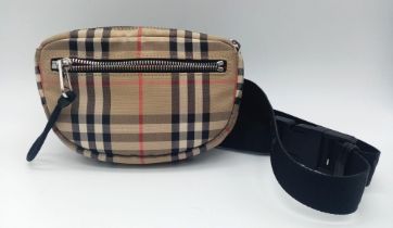 A Burberry canvas bum bag (fanny pack), Silver top zip plus additional zipped pouch to front,