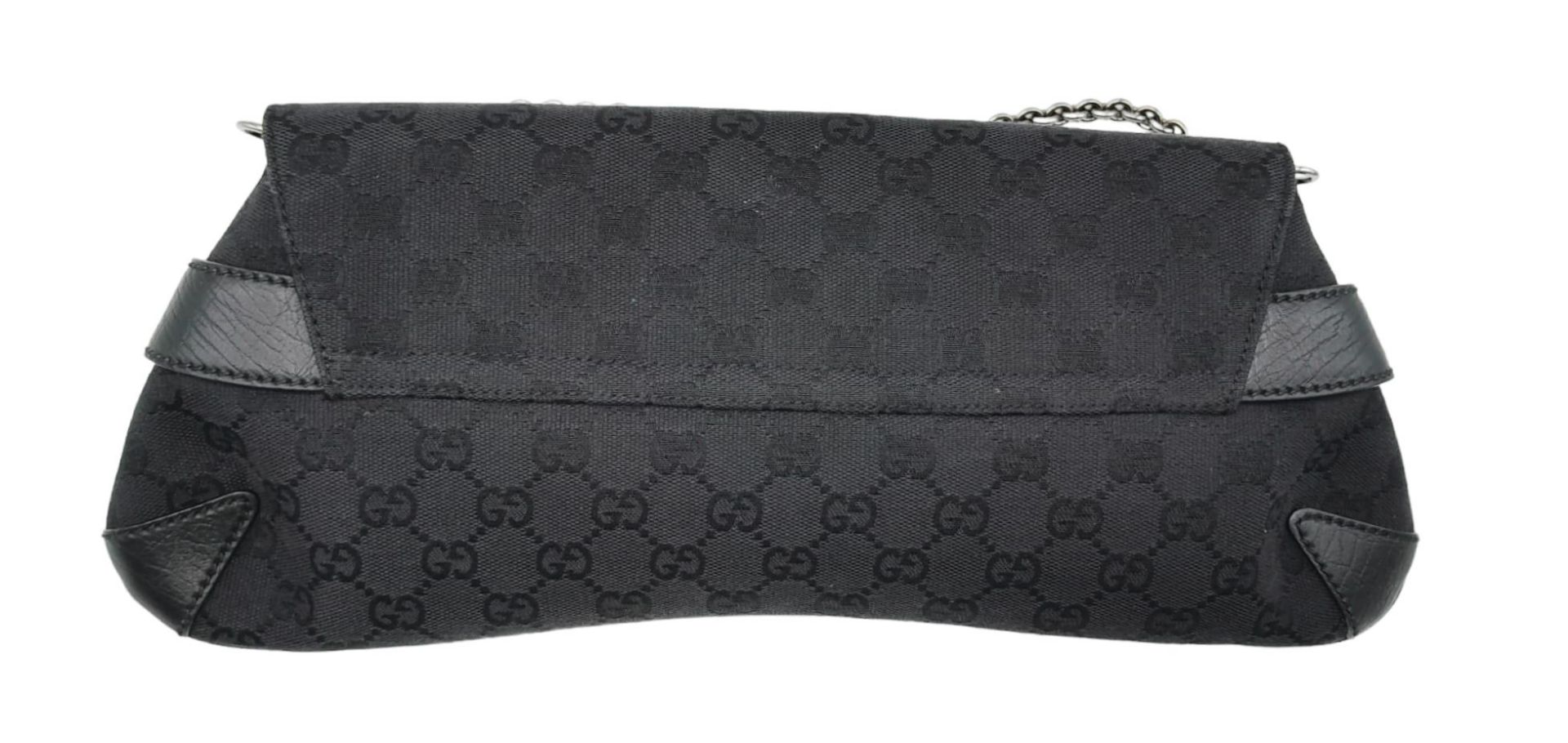 A Gucci GG black canvas bag featuring the black and gunmetal grey horsebit and metal shoulder strap. - Image 2 of 6