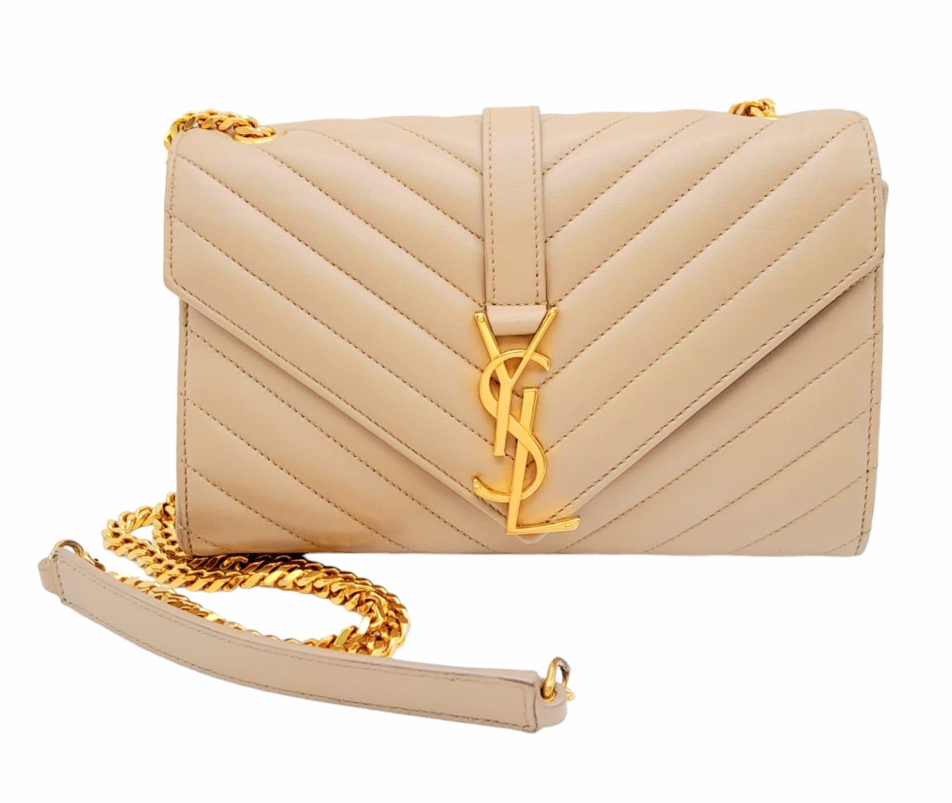 A Saint Laurent envelope shoulder bag, soft beige calfskin with gold hardware and strap, press