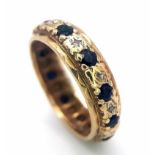 A VINTAGE DIAMOND AND SAPPHIRE FULL ETERNITY RING . 2.7gms size K