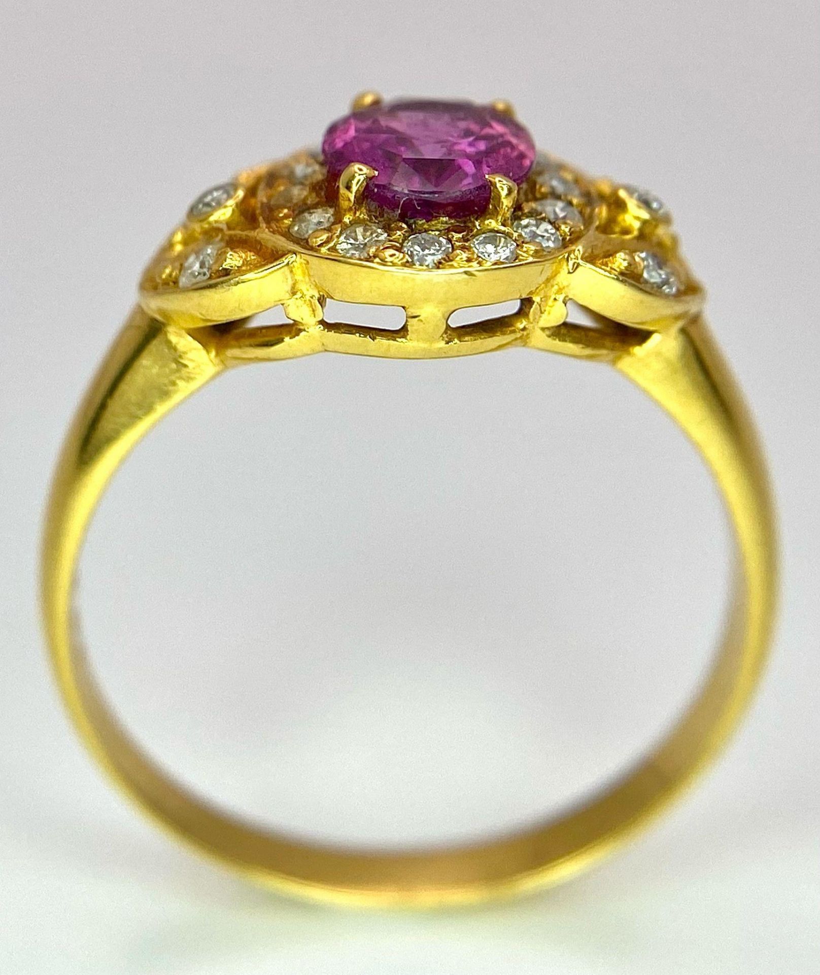 An 18K Yellow Gold Pink Sapphire and Diamond Ring. Central oval sapphire with diamond halo and - Image 7 of 12