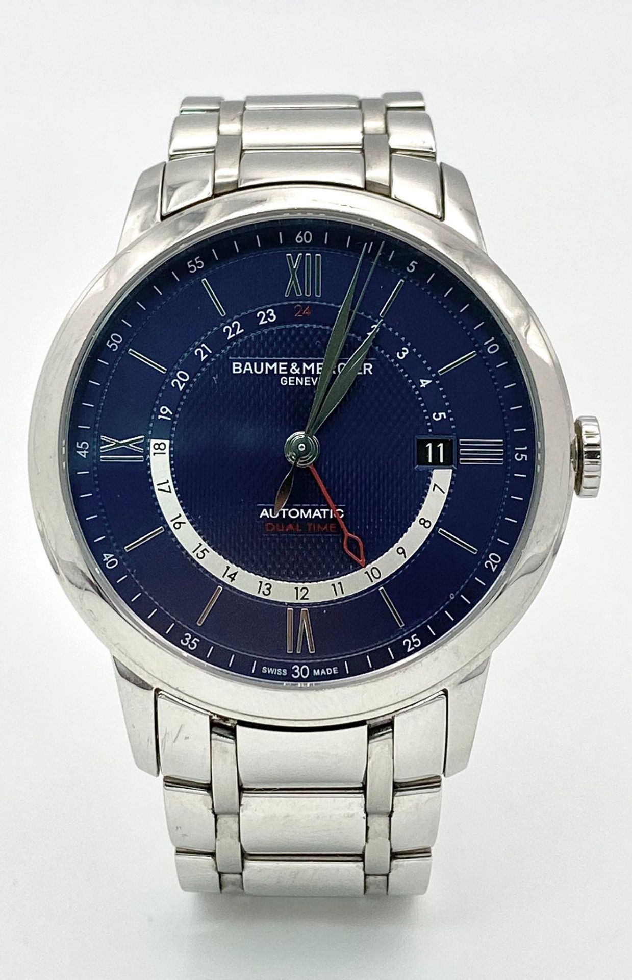 A Baume and Mercier Automatic Dual Time Gents Classima Watch. Stainless steel bracelet and case -