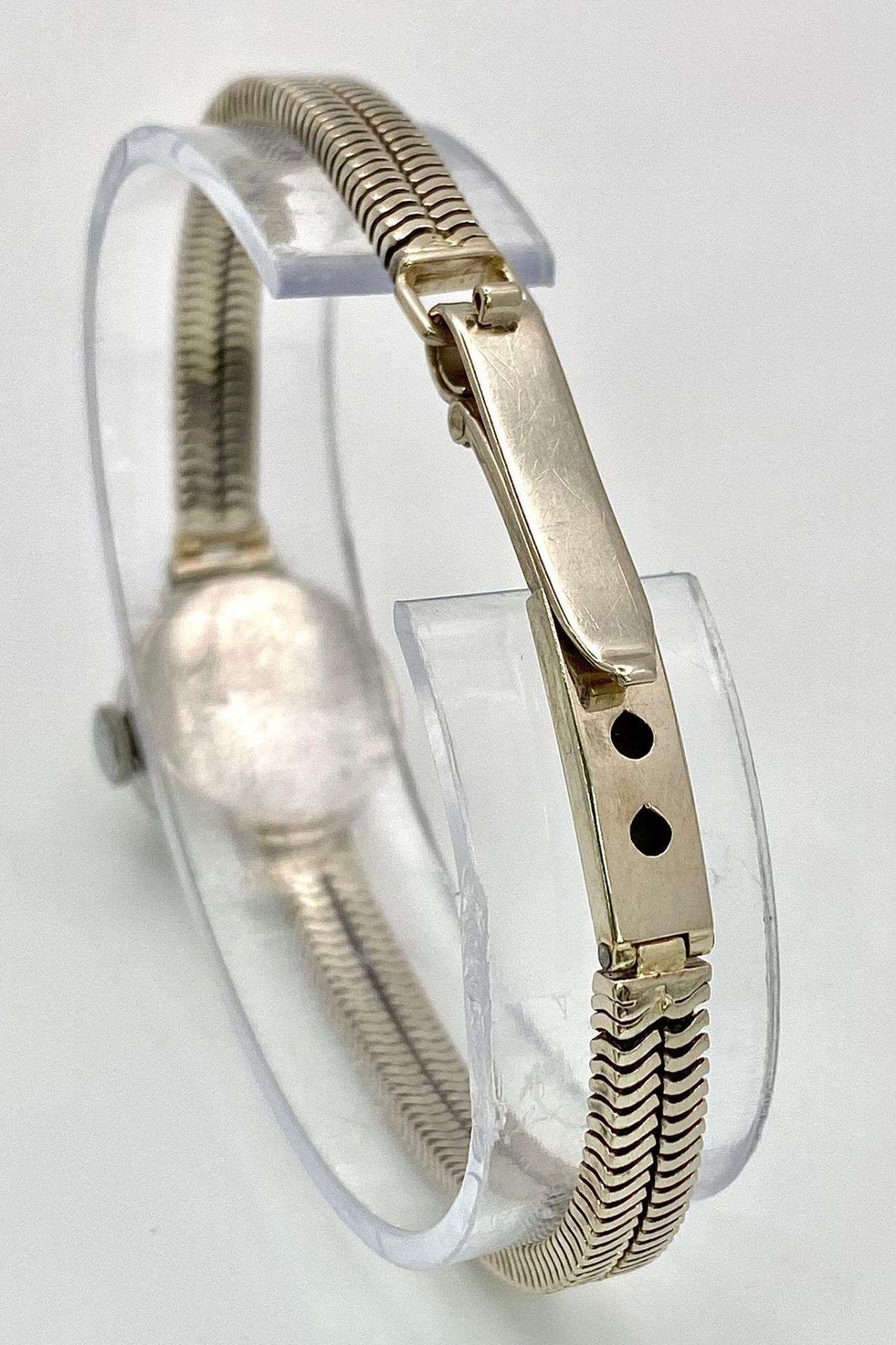 A ladies, platinum watch with diamond bezel and a 9 K white gold double snake chain bracelet. The - Image 5 of 6