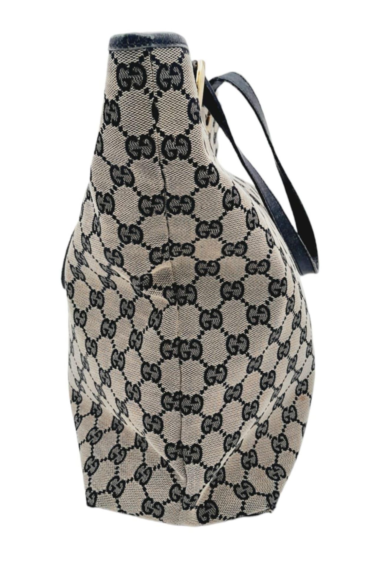 A Gucci GG Brown and Black Monogram Tote Bag. Canvas exterior with leather trim and base, two - Image 2 of 6
