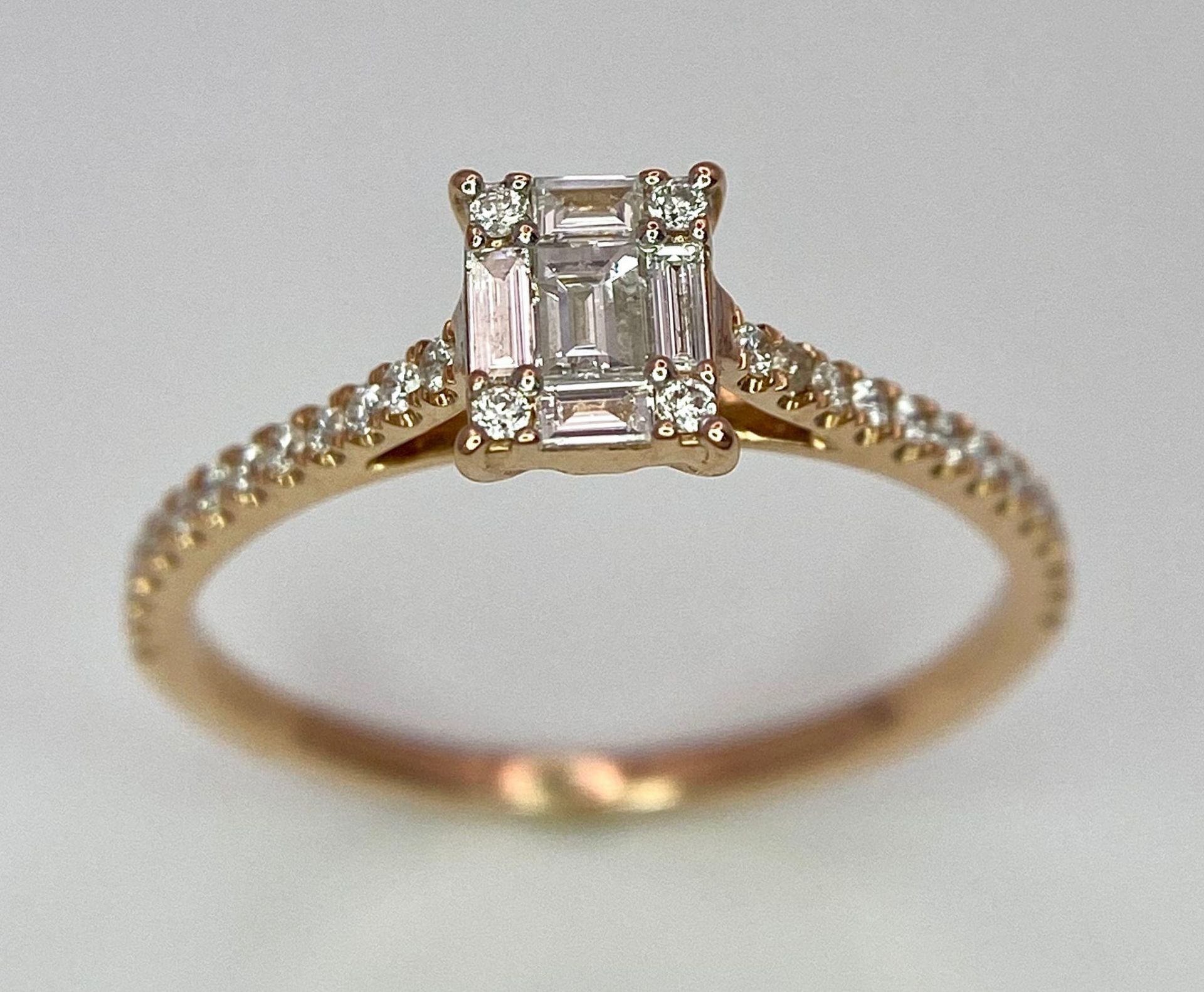 An 18 K rose gold ring with a square emerald cut diamond and more round cut diamonds on the - Image 2 of 8