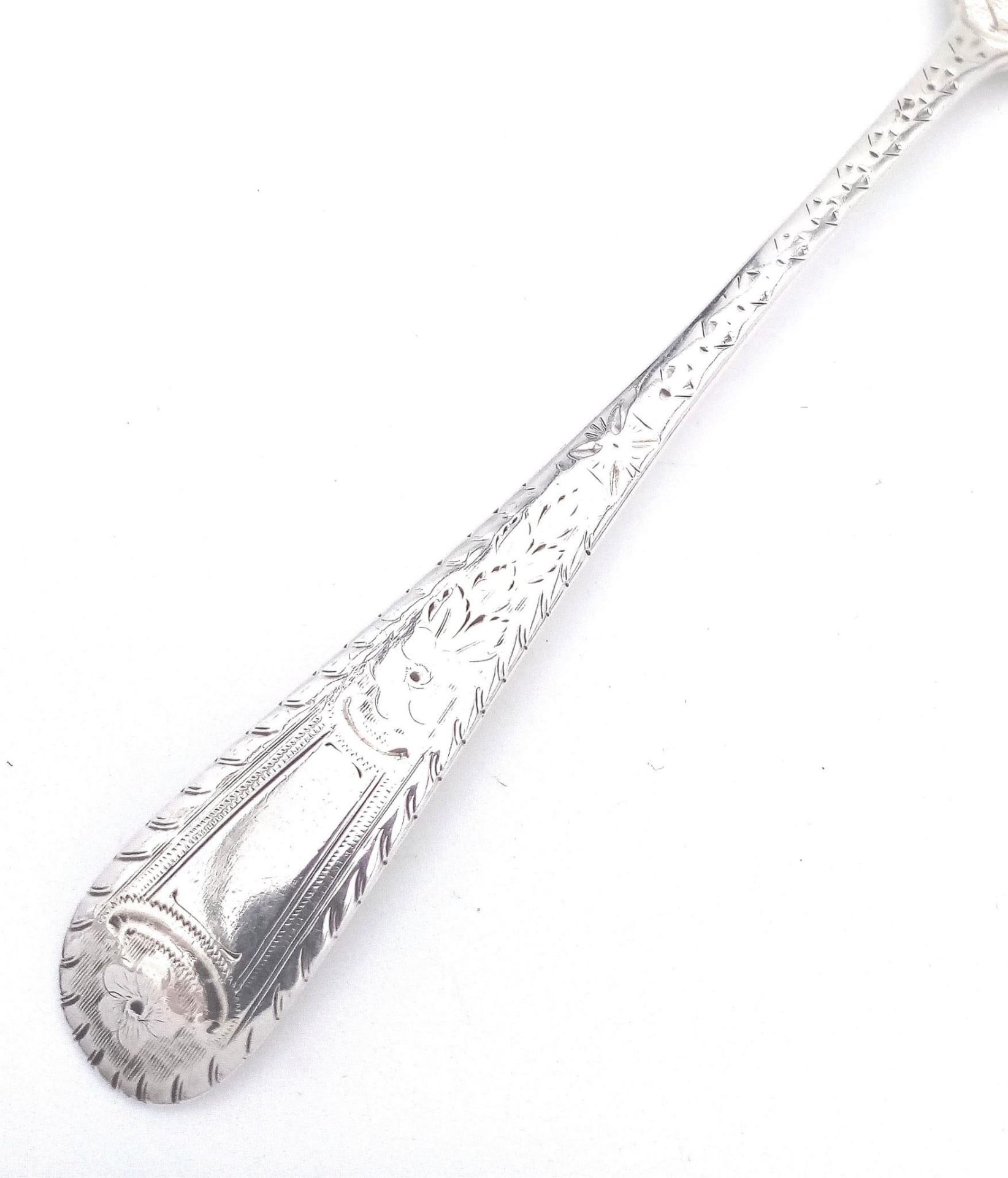 An antique sterling silver dessert spoon with fabulous floral motif engravings on bowl and handle. - Image 3 of 5