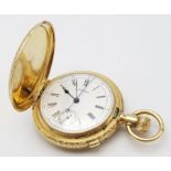 An Antique Waltham 18K Gold Full Hunter Pocket Watch. The case is ornately decorated in a floral