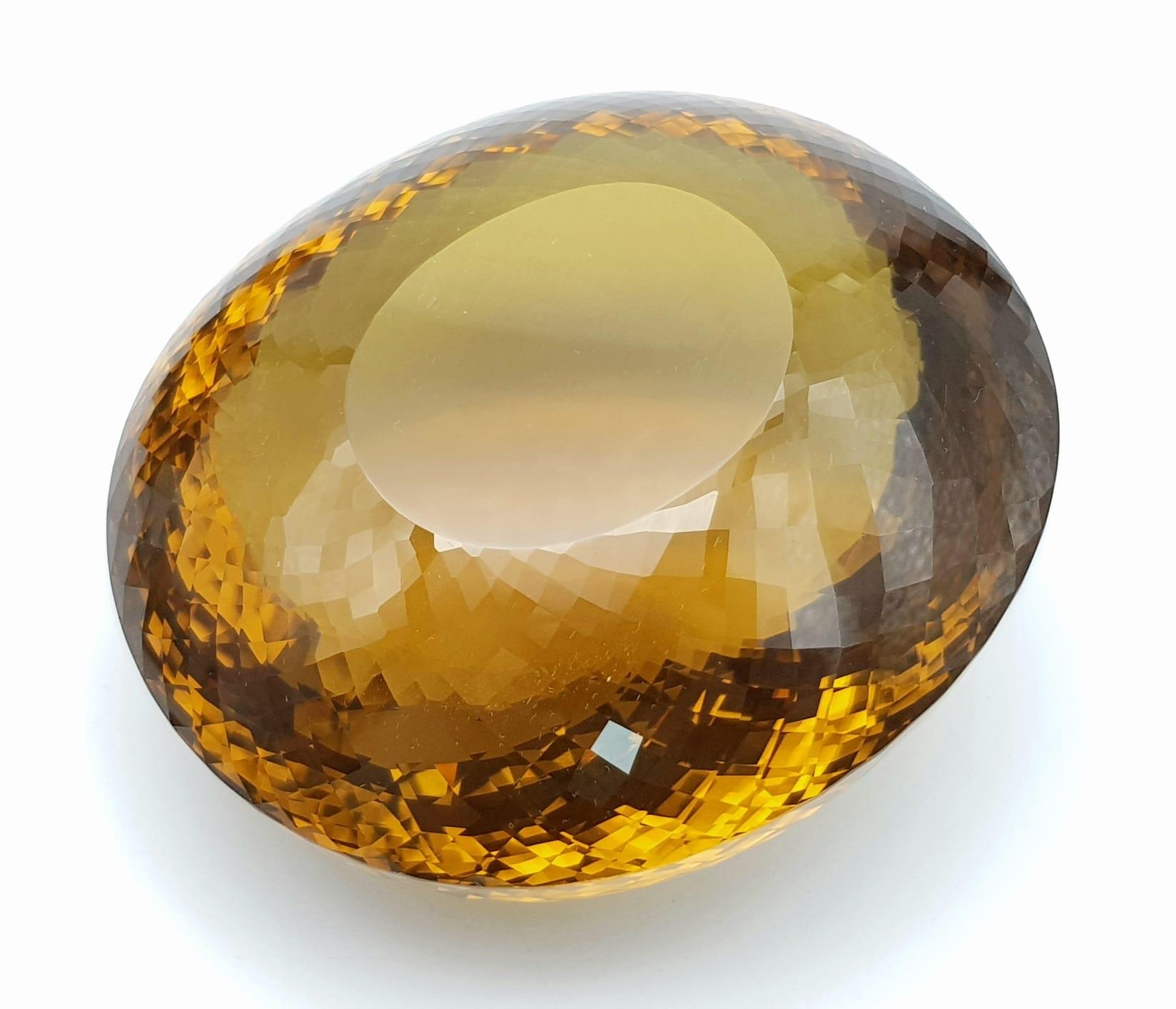 An Immense 3632ct Citrine Quartz Gemstone. Oval cut and beautifully faceted. 10 x 9cm. Comes with - Image 4 of 13