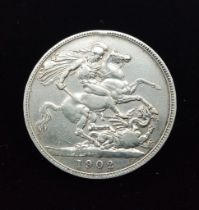 A 1902 Edward VII Silver Crown Coin. VF+ grade but please see photos.