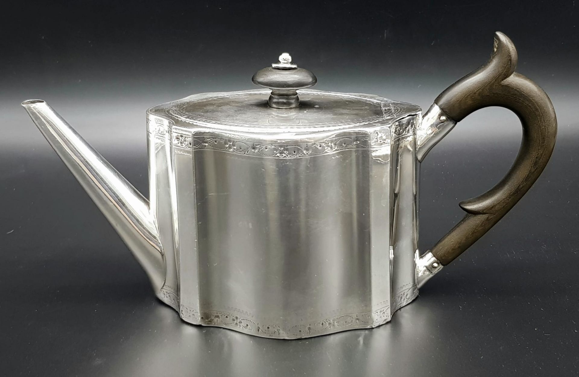 A 1785 Hester Bateman George III Silver Teapot. Oval form with empty cartouche to side. Minimalist