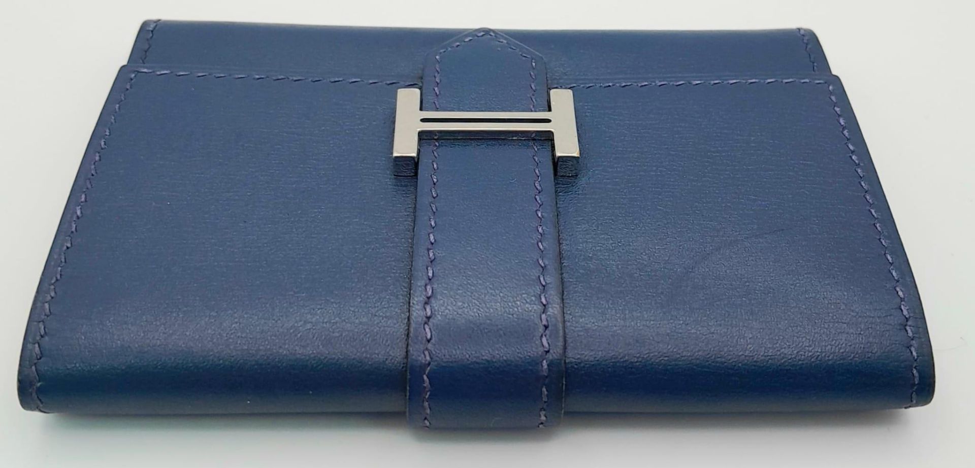 A Small Blue Leather Hermes Ladies Wallet. Flap design with Letter H branding. In good condition but - Image 4 of 7