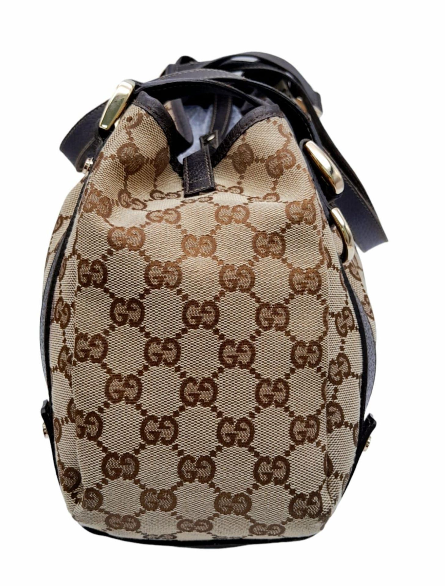 A Gucci Brown Monogram 'Abbey' Shoulder Bag. Canvas exterior with leather trim, gold-toned hardware, - Image 3 of 8