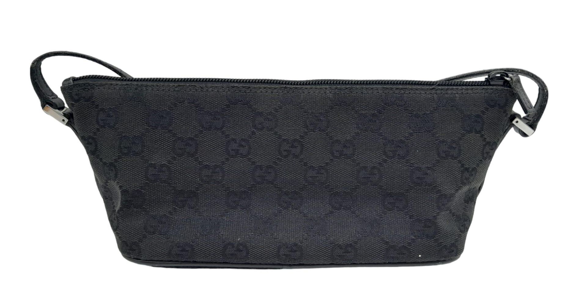 A Gucci Black Monogram Pochette Boat Bag. Textile exterior with black and silver-toned hardware, - Image 2 of 7