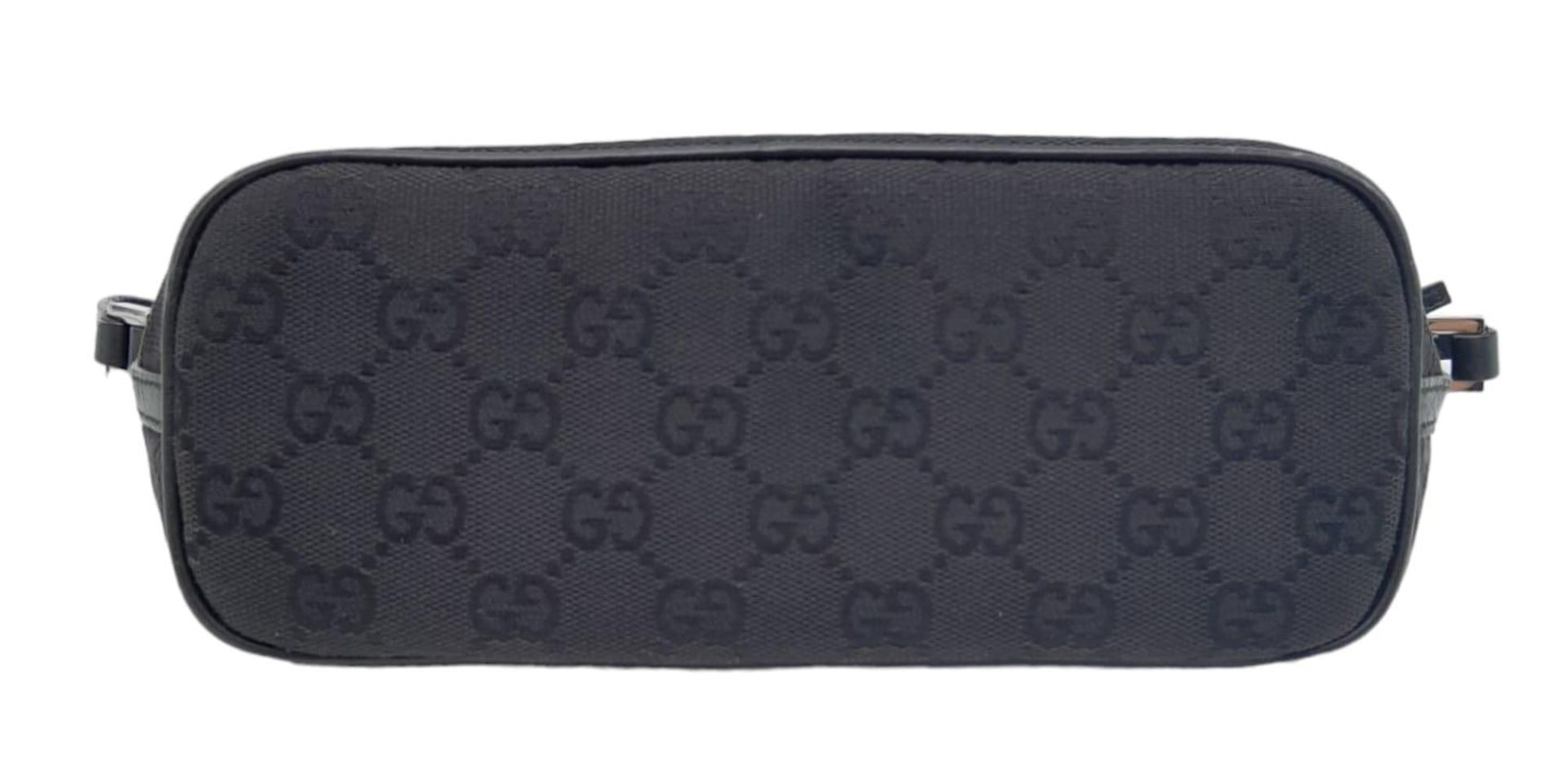 A Gucci Black Monogram Pochette Boat Bag. Textile exterior with black and silver-toned hardware, - Image 3 of 7