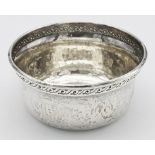 A SOLID SILVER BOWL MADE BY JOHN LAWRENCE & CO IN BIRMINGHAM AND DATED 1913 , WITH HAND ETCHED RIM .