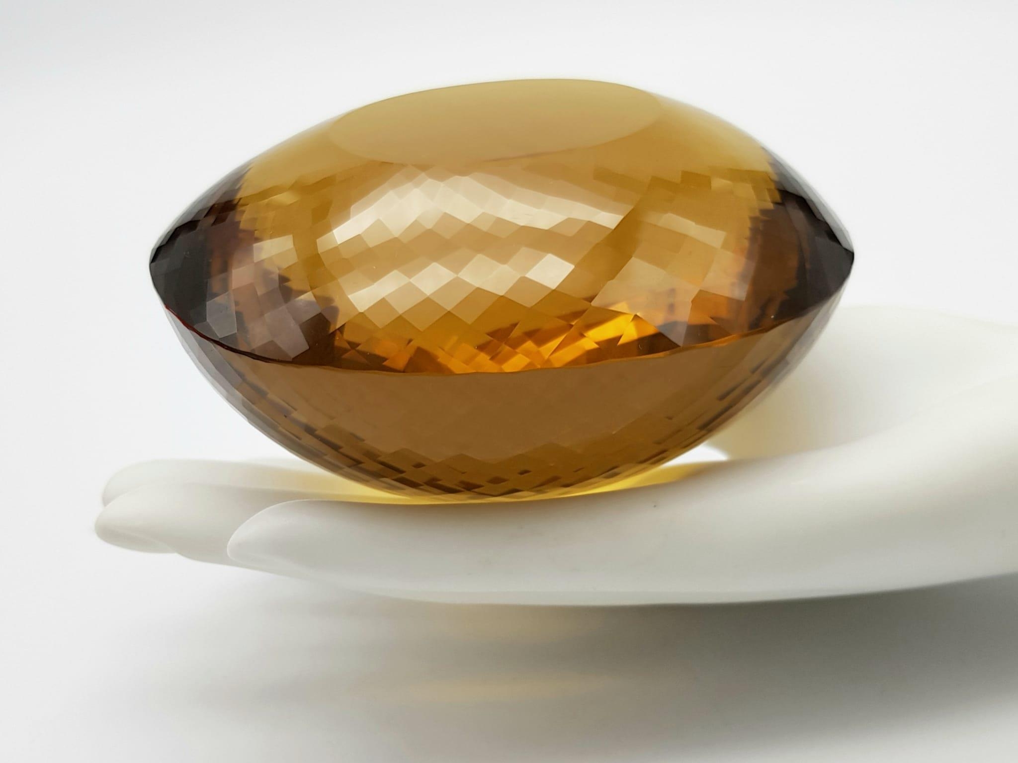 An Immense 3632ct Citrine Quartz Gemstone. Oval cut and beautifully faceted. 10 x 9cm. Comes with - Image 3 of 13