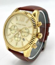 A Designer Michael Kors Chronograph Gents Watch. Brown leather strap. Gilded case - 45mm. Cream dial