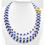 A very elegant and sophisticated four strand necklace with alternating blue sapphires and