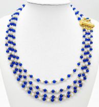 A very elegant and sophisticated four strand necklace with alternating blue sapphires and