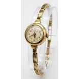 A very elegant, vintage, 9 K yellow gold WINEGARTENS, LONDON E.C. 2 ladies watch. Champagne coloured