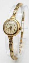 A very elegant, vintage, 9 K yellow gold WINEGARTENS, LONDON E.C. 2 ladies watch. Champagne coloured