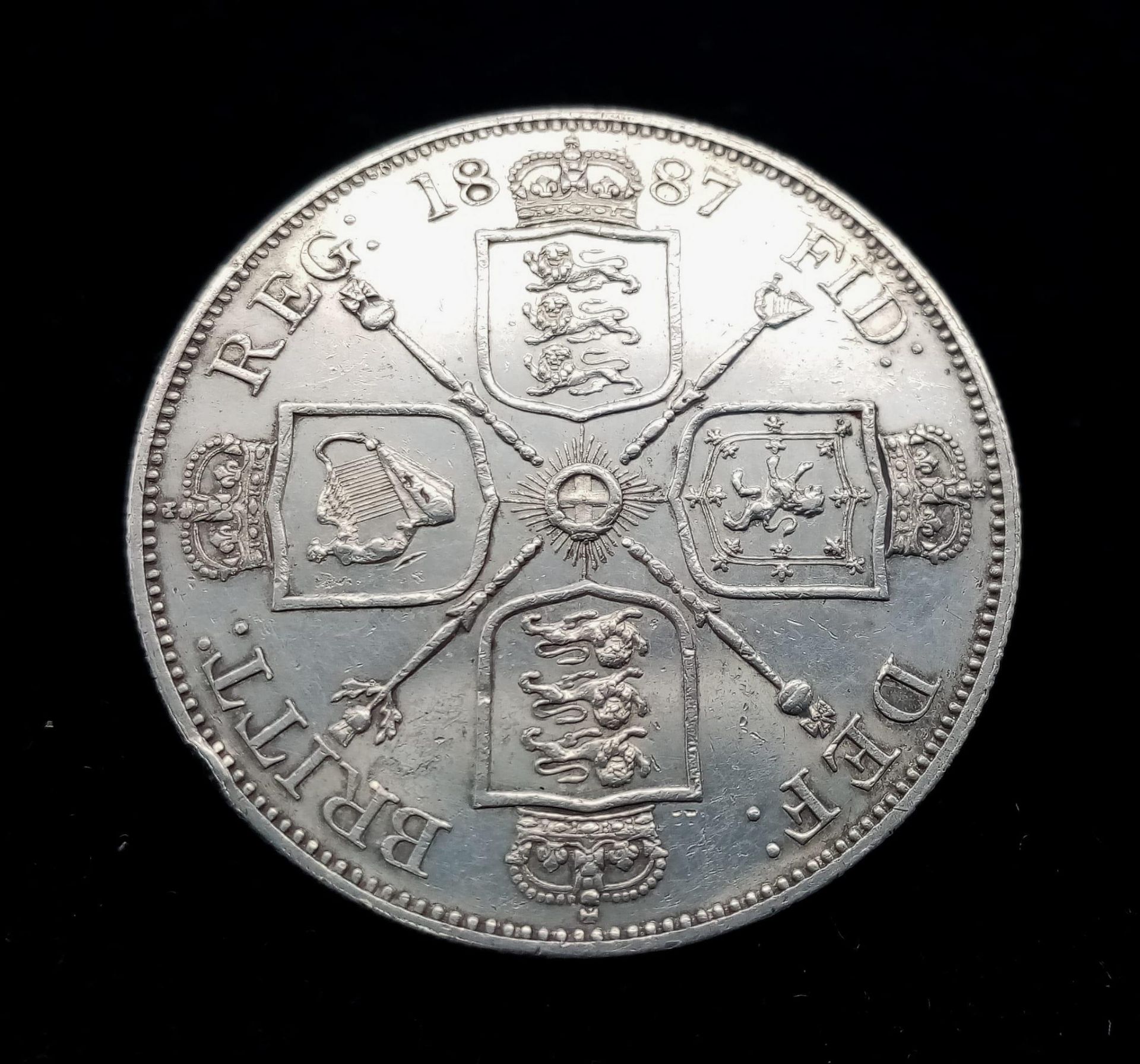 An 1887 Queen Victoria Double Florin Silver Coin. EF grade but please see photos.