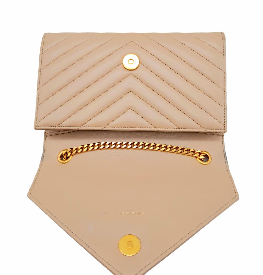 A Saint Laurent envelope shoulder bag, soft beige calfskin with gold hardware and strap, press - Image 5 of 11
