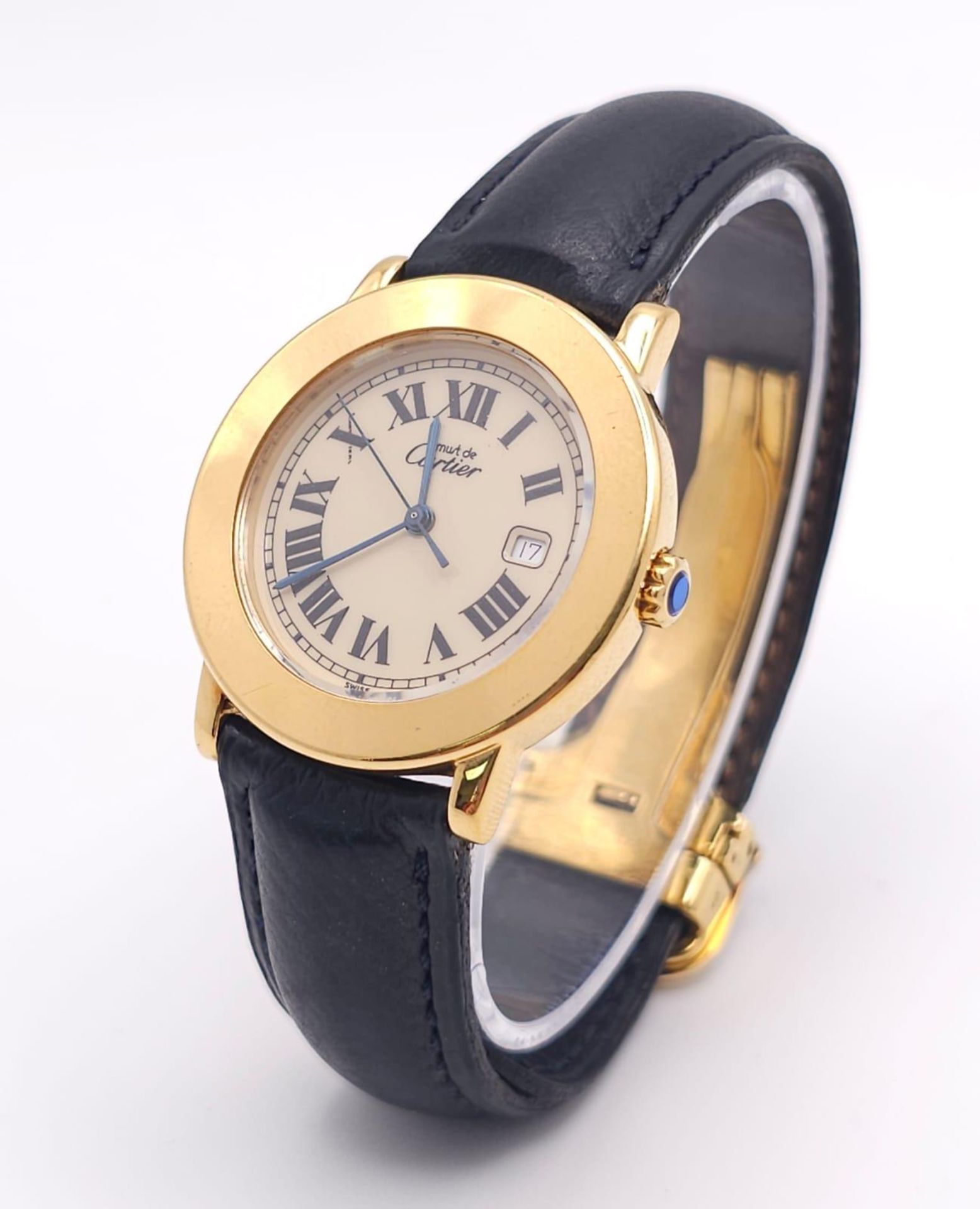A Must De Cartier Gold Plated Silver Quartz Ladies Watch. Black leather strap. Gold plated silver