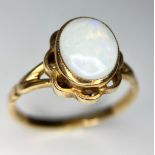 A Vintage 9K Yellow Gold Opal Ring. Central colour-plat opal cabochon. Size M. 2.4g weight.