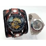 A Winner Automatic Skeleton Gents Watch (works) and a Ladies Ice Watch (needs a battery). Both in