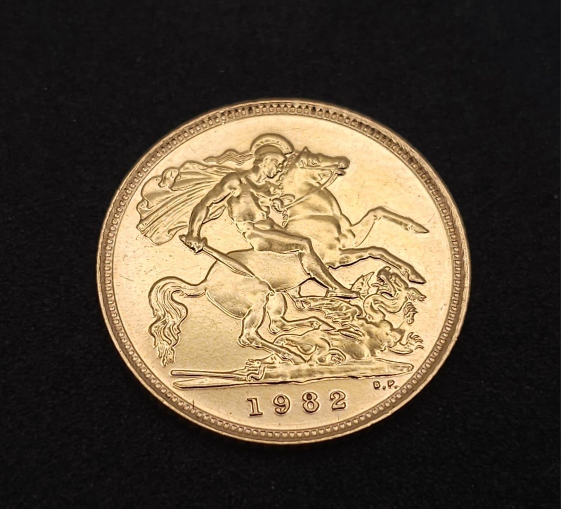 A 1982 Queen Elizabeth II 22K Gold Half Sovereign. - Image 3 of 5