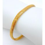 A 9 K yellow gold snake skin bracelet, length: 19 cm, weight: 11.1 g