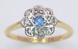 A vintage, 18 K yellow gold and platinum ring with a blue sapphire surrounded by diamonds, size: