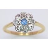 A vintage, 18 K yellow gold and platinum ring with a blue sapphire surrounded by diamonds, size: