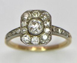 A 9 K yellow gold ring with an ART DECO style diamond cluster and more diamonds on the shoulders,