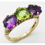 A Vintage Amethyst and Peridot 9K Yellow Gold Ring. Suffragette colours. Size O. 4.26g total weight.