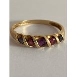 Unusual 9 carat YELLOW GOLD RING . Having 5 x GEMSTONES to include GARNET and TOURMALINE etc, set to