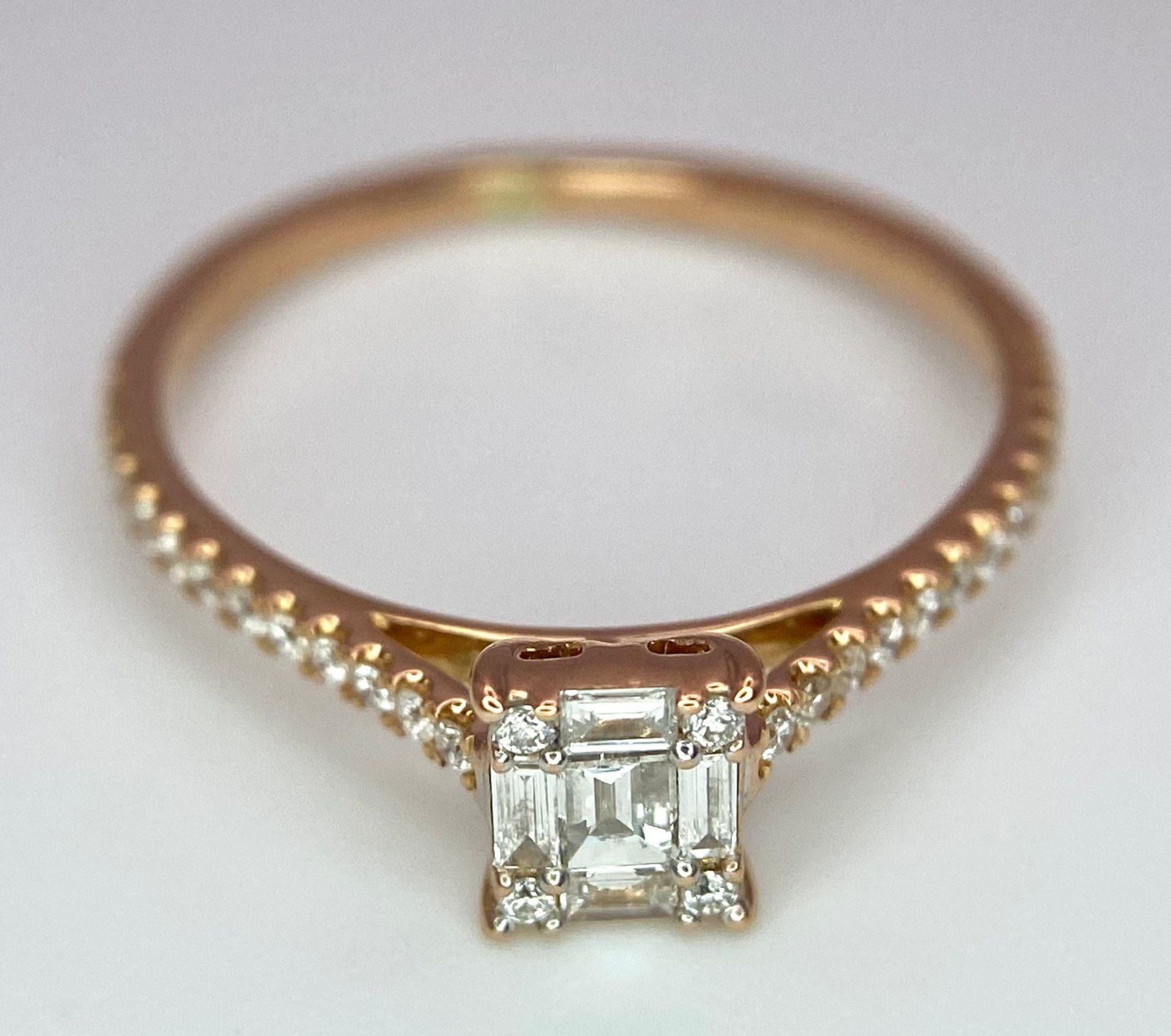 An 18 K rose gold ring with a square emerald cut diamond and more round cut diamonds on the - Image 4 of 8