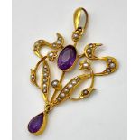 A beautiful ART NOUVEAU 9 K yellow gold pendant with vivid coloured amethysts and natural seed