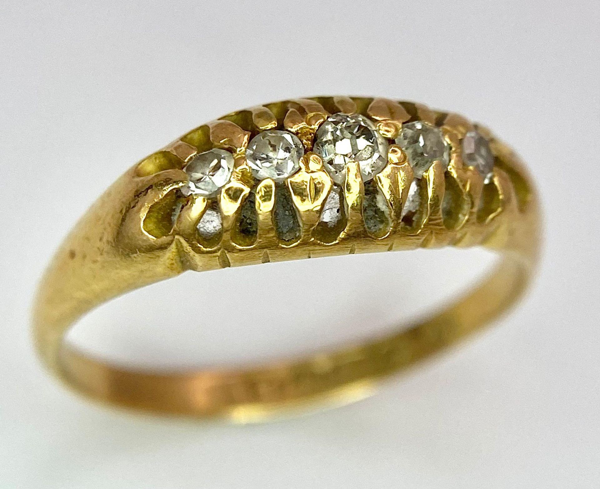 An 18 K yellow gold ring with a band of five diamonds, size: O, weight: 3.2 g. - Image 3 of 7