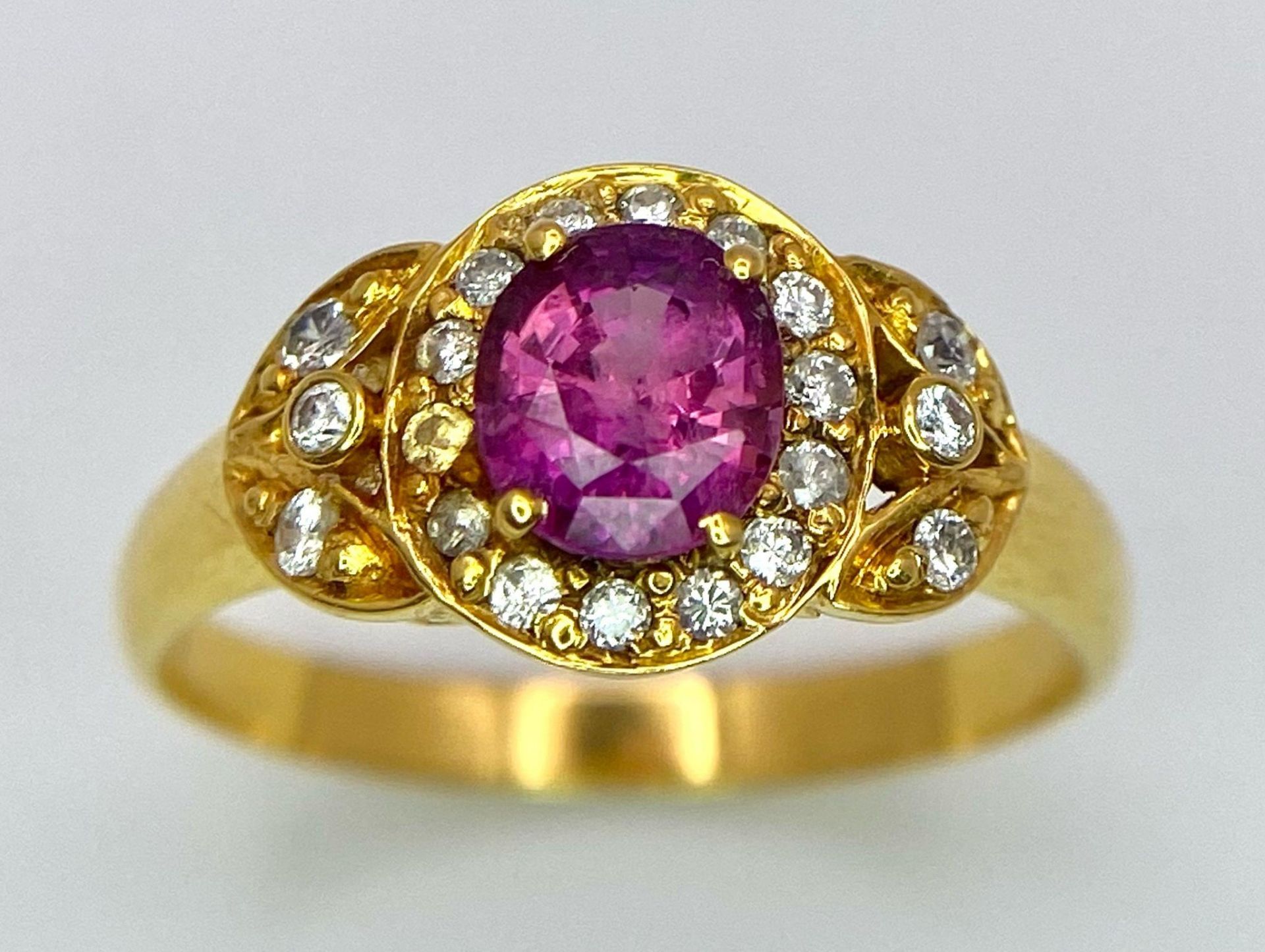An 18K Yellow Gold Pink Sapphire and Diamond Ring. Central oval sapphire with diamond halo and - Image 8 of 12