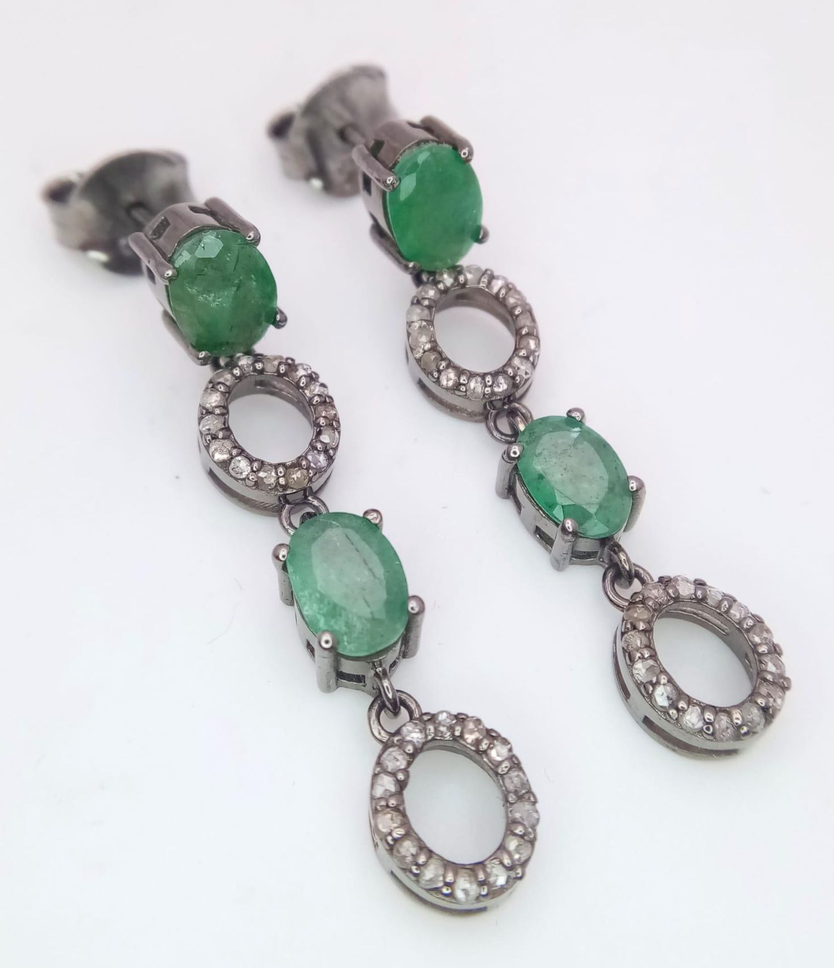 A Pair of Zambian Emerald & Diamond Silver Drop Earrings. Emerald -2.68ctw. Diamond- 0.60ctw. 4cm