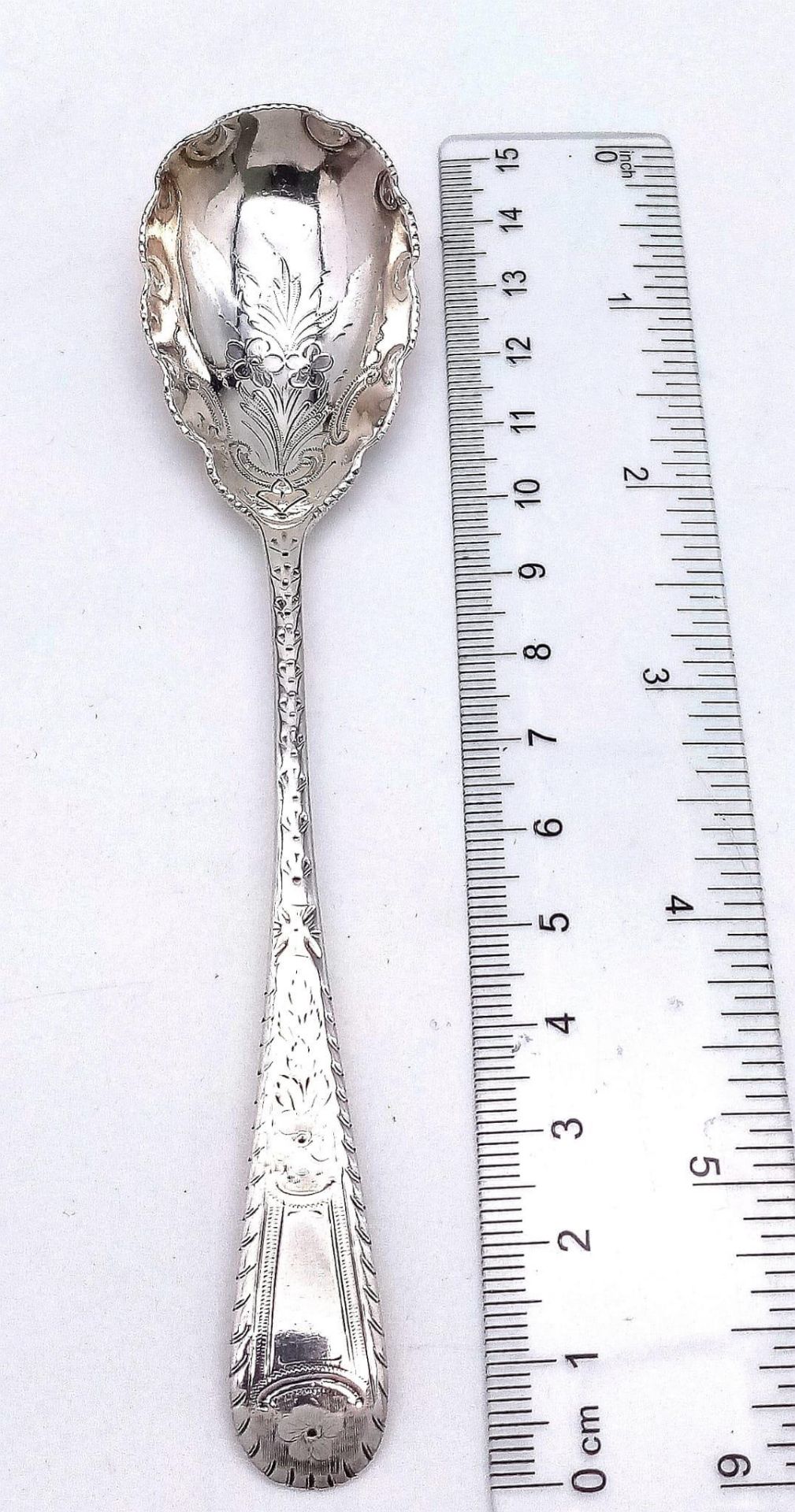 An antique sterling silver dessert spoon with fabulous floral motif engravings on bowl and handle. - Image 5 of 5