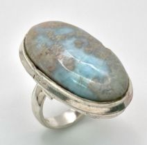 A sterling silver ring with a large (30 x 16 x 5 mm) LARIMAR cabochon, presented in beautiful