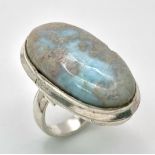 A sterling silver ring with a large (30 x 16 x 5 mm) LARIMAR cabochon, presented in beautiful