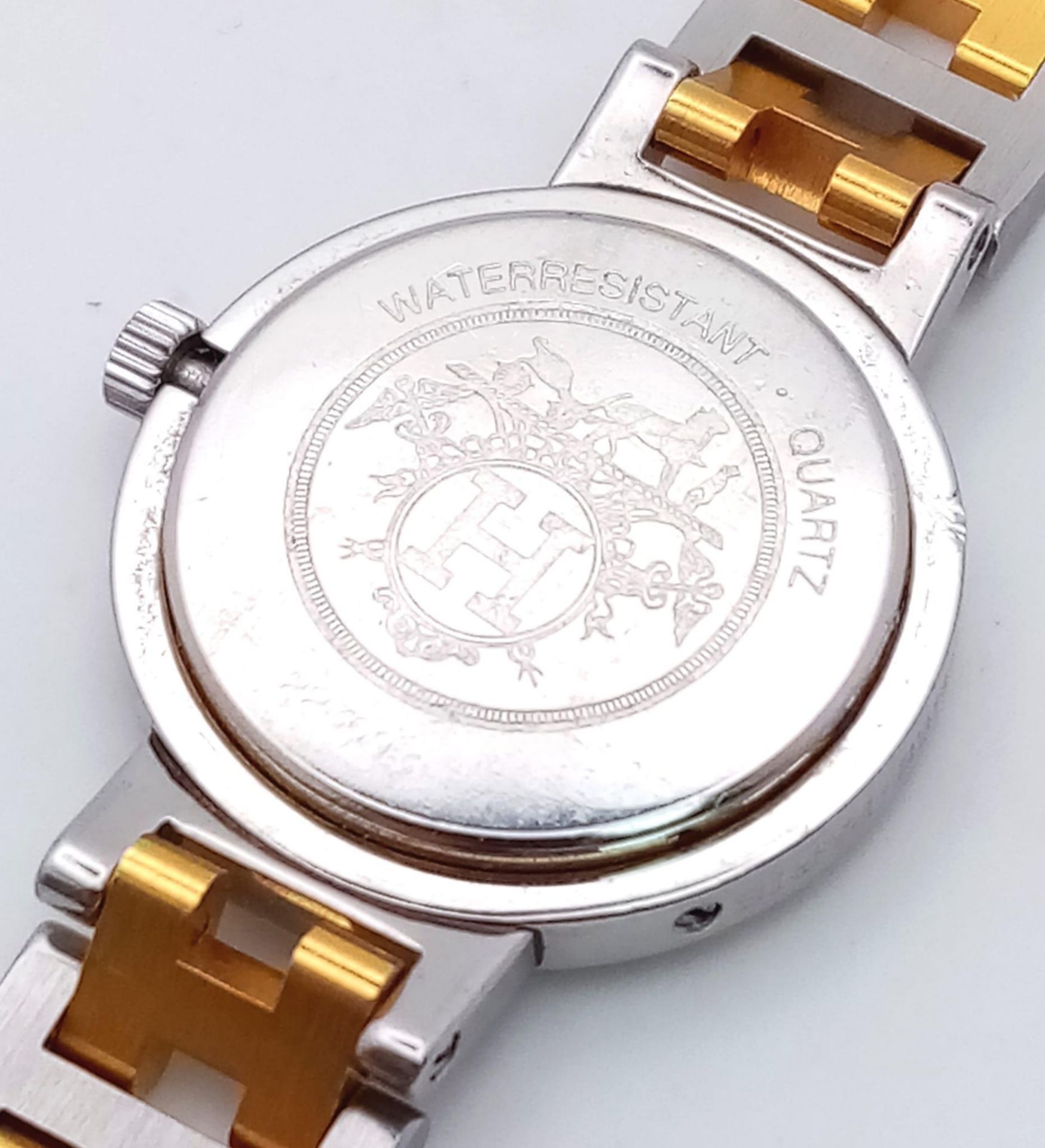 A Designer Hermes Quartz Ladies Watch. Two tone stainless steel bracelet and case - 25m. White - Image 4 of 5