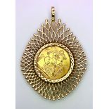 A 1904 SOVEREIGN COIN MOUNTED IN A 9K GOLD FILIGREE SETTING . 14.3gms